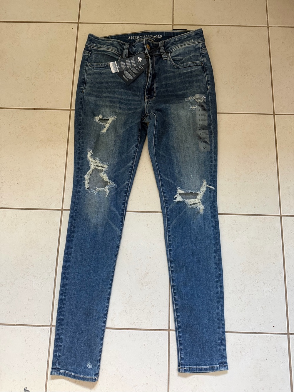 American Eagle Outfitters Distressed Skinny Jeans in Medium Blue Wash